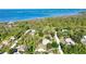 A secluded property is close to the river and features an outbuilding and lush landscaping at 941 Elwood Ave, Englewood, FL 34223