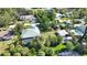 Home featuring a screened-in pool, shed, RV parking and mature trees at 941 Elwood Ave, Englewood, FL 34223