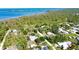 Real estate with mature trees, RV parking, and outbuilding situated near the water at 941 Elwood Ave, Englewood, FL 34223