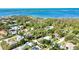 Property featuring RV parking, outbuilding, and screened-in pool in lush landscape at 941 Elwood Ave, Englewood, FL 34223