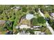 Aerial view showcasing the house location amongst lush landscaping and a storage shed at 941 Elwood Ave, Englewood, FL 34223