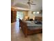 Spacious primary bedroom boasts a tray ceiling and access to a pool area via sliding glass doors at 941 Elwood Ave, Englewood, FL 34223