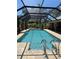 Inviting screened-in pool with access to covered patio, perfect for entertaining guests at 941 Elwood Ave, Englewood, FL 34223