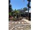 Lush landscaping surrounds a screened in pool and deck area at 941 Elwood Ave, Englewood, FL 34223