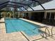 Inviting screened-in pool with access to covered patio, perfect for entertaining guests at 941 Elwood Ave, Englewood, FL 34223