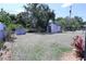 Backyard with a shed, chain-link fence and minimal landscaping at 10275 Euston Ave, Englewood, FL 34224