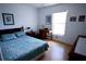 Bedroom features a window and small desk and creates a comfortable and functional space at 10275 Euston Ave, Englewood, FL 34224