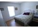 Bright bedroom featuring a window and a small table, creating a cozy and inviting space at 10275 Euston Ave, Englewood, FL 34224