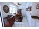 Bright dining area featuring a bay window, tile flooring, and a classic china cabinet at 10275 Euston Ave, Englewood, FL 34224