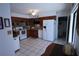 Well-lit kitchen featuring modern appliances, tile flooring, and ample cabinet space at 10275 Euston Ave, Englewood, FL 34224