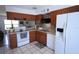 Functional kitchen with modern appliances, stylish backsplash, and abundant counter space at 10275 Euston Ave, Englewood, FL 34224