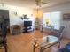 Cozy living area featuring wood floors, neutral tones, and ample natural light at 10275 Euston Ave, Englewood, FL 34224