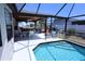 A screened-in pool with a covered patio and plenty of room for seating and entertaining at 10275 Euston Ave, Englewood, FL 34224