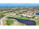 Gorgeous aerial view of waterfront homes in community with beautiful lake and a golf course at 105 Westwind Dr, Placida, FL 33946