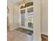 Elegant foyer with tiled floors, decorative lighting, and view of the front yard at 105 Westwind Dr, Placida, FL 33946