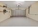 A spacious garage featuring an epoxy floor, an automatic door opener, and ample room for parking and storage at 105 Westwind Dr, Placida, FL 33946