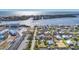 Scenic aerial view of a coastal community highlighting the marina, nearby waterways, and stunning ocean views at 10500 Sherman St, Englewood, FL 34224