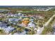 Aerial view of home and community featuring waterfront properties near the golf course at 10500 Sherman St, Englewood, FL 34224