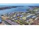 Breathtaking aerial view of coastal neighborhood highlighting waterfront homes and stunning blue waterways and ocean at 10500 Sherman St, Englewood, FL 34224