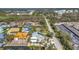 Aerial view of a neighborhood featuring mature trees and canal-front homes at 10500 Sherman St, Englewood, FL 34224