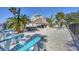 Spacious backyard with tiki hut, hot tub, and beach area, perfect for outdoor entertaining at 10500 Sherman St, Englewood, FL 34224