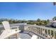 Balcony with seating offering panoramic views of tropical landscape and water at 10500 Sherman St, Englewood, FL 34224