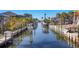Scenic canal view with boat docks, offering direct access to the water at 10500 Sherman St, Englewood, FL 34224