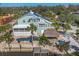 Exterior of home featuring a pool, tiki hut, canal, and solar panels at 10500 Sherman St, Englewood, FL 34224
