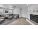 Comfortable living area featuring a fireplace, neutral decor, and plenty of seating at 10500 Sherman St, Englewood, FL 34224