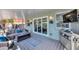 Screened in outdoor patio featuring comfortable seating, perfect for relaxation and enjoying the outdoors at 10500 Sherman St, Englewood, FL 34224
