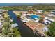 Aerial view showcasing the home's waterfront location with a private boat dock and pool at 1167 Delmar St, Englewood, FL 34224