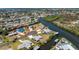 An aerial view of a charming neighborhood with waterfront homes on the canal at 1167 Delmar St, Englewood, FL 34224
