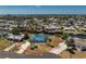 Charming waterfront home with a blue roof, boat dock and lift access to the canal at 1167 Delmar St, Englewood, FL 34224