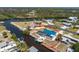 Aerial shot of waterfront home with boat dock, pool, and canal access at 1167 Delmar St, Englewood, FL 34224