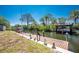 Private wooden dock extending into canal, perfect for enjoying waterside activities and scenic views at 1167 Delmar St, Englewood, FL 34224