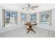 Bright Florida room with a table and views of the pool and outdoor scenery at 1167 Delmar St, Englewood, FL 34224