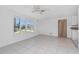 Neutral living area featuring tile floors, natural light, and easy access to the kitchen area at 1167 Delmar St, Englewood, FL 34224