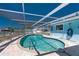 Inviting screened pool area with clear blue water, perfect for relaxation and outdoor enjoyment at 1167 Delmar St, Englewood, FL 34224