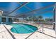 Beautiful pool with a screened enclosure, offering a refreshing escape and outdoor entertainment at 1167 Delmar St, Englewood, FL 34224