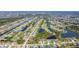 Picturesque aerial of homes along canals adjacent to a golf course and neighborhood amenities at 1167 Rotonda Cir, Rotonda West, FL 33947