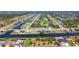Aerial view of the waterfront community with canals, lakes, and a golf course at 1167 Rotonda Cir, Rotonda West, FL 33947