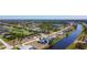 Aerial view of the community with canal access, golf course and lake views at 1167 Rotonda Cir, Rotonda West, FL 33947