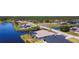 Aerial view of a canal home with a screened lanai and beautiful community at 1167 Rotonda Cir, Rotonda West, FL 33947