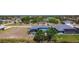 Aerial view of the backyard with screened pool and lake in a desirable community at 1167 Rotonda Cir, Rotonda West, FL 33947