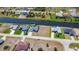 Wide aerial view of waterfront homes showcasing canals, landscaping, and neighborhood layout at 1167 Rotonda Cir, Rotonda West, FL 33947