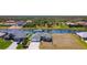 An aerial view of a stunning waterfront home featuring a spacious lot, lush landscaping, and serene canal at 1167 Rotonda Cir, Rotonda West, FL 33947