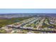 High angle shows a residential community with waterfront homes along canals and a golf course at 1167 Rotonda Cir, Rotonda West, FL 33947