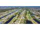Scenic aerial shot showcasing homes on canals with a golf course woven throughout the community at 1167 Rotonda Cir, Rotonda West, FL 33947