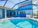 Wide angle shot of the pool and outdoor living space including the backyard at 1167 Rotonda Cir, Rotonda West, FL 33947