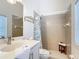 Bathroom boasts a tiled shower with decorative curtain, modern sink, and a comfortable stool at 1167 Rotonda Cir, Rotonda West, FL 33947